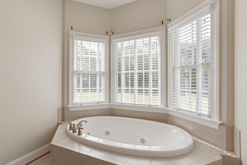 Modern window coverings including roller shades and shutters